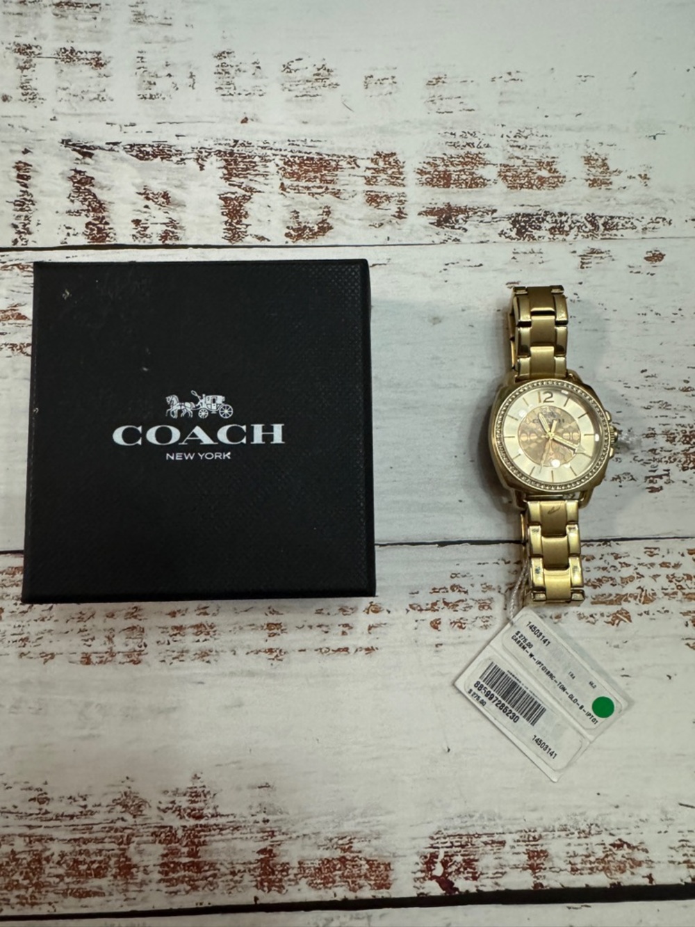 Beautiful Coach New York gold-tone bracelet watch with a classic, elegant look.